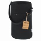 Black cylindrical recycled cotton bag with a shoulder strap and a brown tag attached.