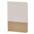 A closed notebook with a textured fabric cover and leather-like bottom section.