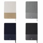 Four notebooks with dual-tone covers: beige, gray, navy, and black, each with a ribbon bookmark.