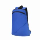 Blue minimalist backpack with black zipper and trim on a white background.