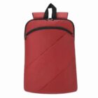 Minimalist red backpack with a top handle and front zipper pocket.