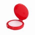 Open red compact case with a white powder inside.