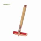 Bamboo pen with copper accents and a red cap, standing against a white background.