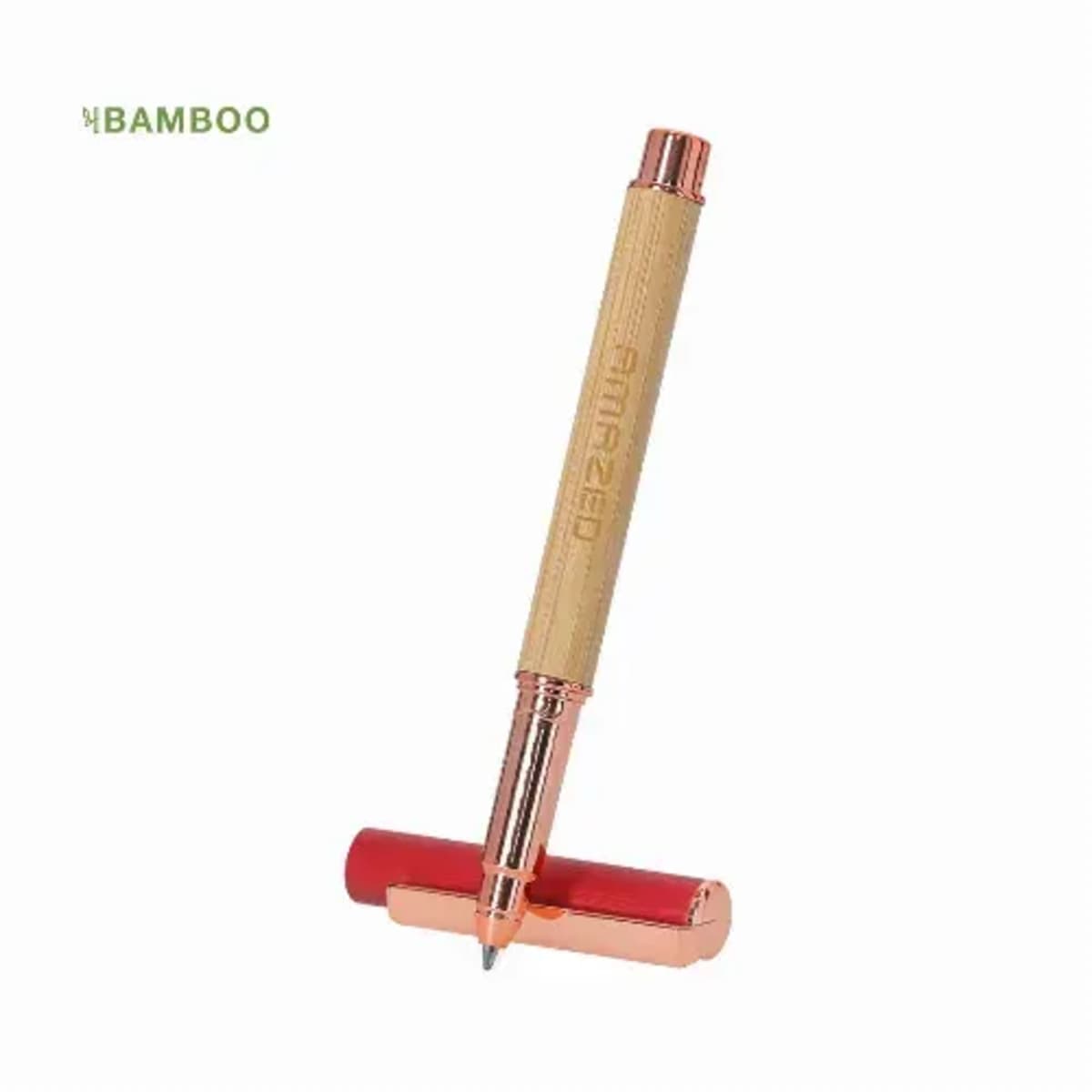Bamboo pen with copper accents and a red cap, standing against a white background.