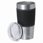 Black and silver travel mug with clear plastic lid beside it.