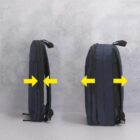 Two backpacks side by side showing expandable design with yellow arrows.