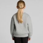 Person with long hair in a ponytail wearing a gray sweatshirt, facing away.