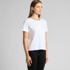Person in a white t-shirt and black pants stands against a gray background.