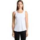 Woman in a white tank top and black pants against a plain white background.