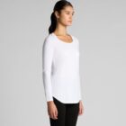 Person in white long-sleeve shirt and black pants, standing sideways.