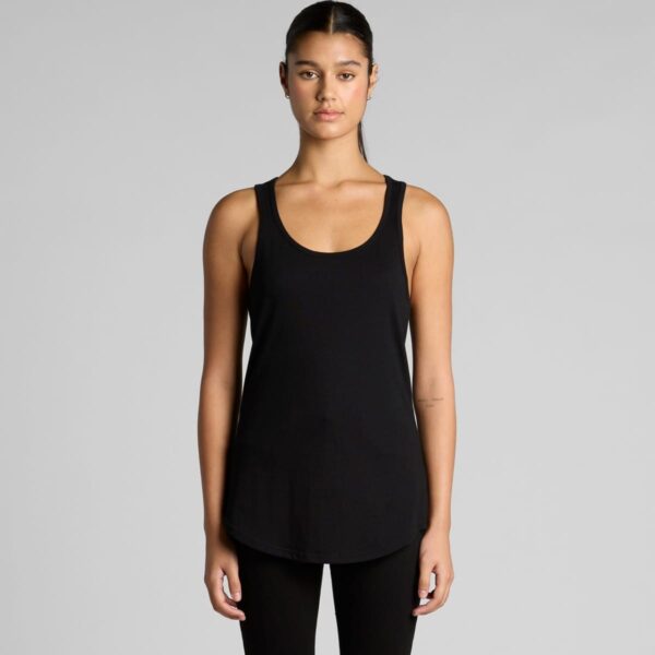 Person wearing a black tank top and black pants against a plain background.
