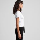 Woman in a white t-shirt and black pants standing in profile against a plain background.