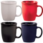 Four ceramic mugs in white, red, black, and blue, arranged in a 2x2 grid.