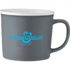 Gray mug with Regan & Nolan Since 1945 printed in blue on the side.