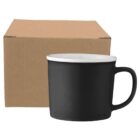 Black ceramic mug with white interior in front of a plain brown cardboard box.