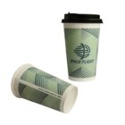 Two Space Flight coffee cups with teal and dark blue geometric designs.