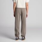 Person wearing beige pants and a white shirt, standing with their back to the camera.