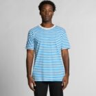 Man wearing a blue and white striped T-shirt, standing against a plain background.