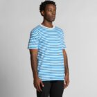 Man wearing a blue and white striped t-shirt and black pants, standing against a plain background.