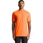 Man wearing a bright orange short-sleeve t-shirt and black pants, standing facing forward.