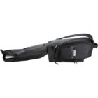 Black guitar case with multiple compartments and zippers, shown in a side view.