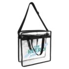 Clear tote bag with black straps and “The Retro Studio” logo on the front.