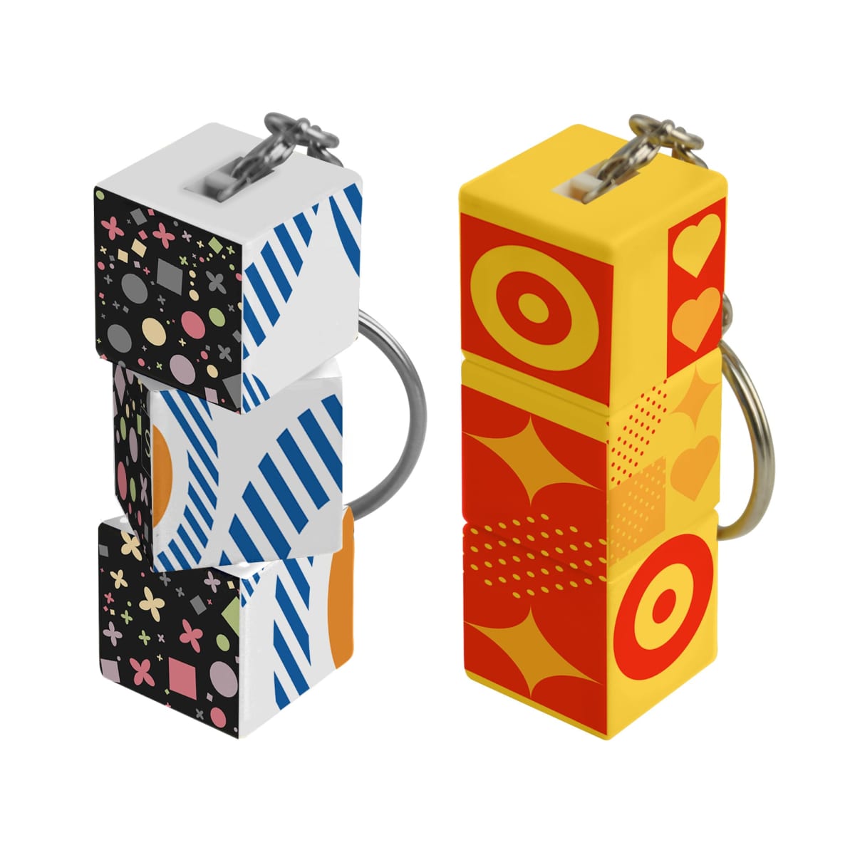Two colorful cube-shaped keychains, one with geometric patterns, the other with circles and hearts.