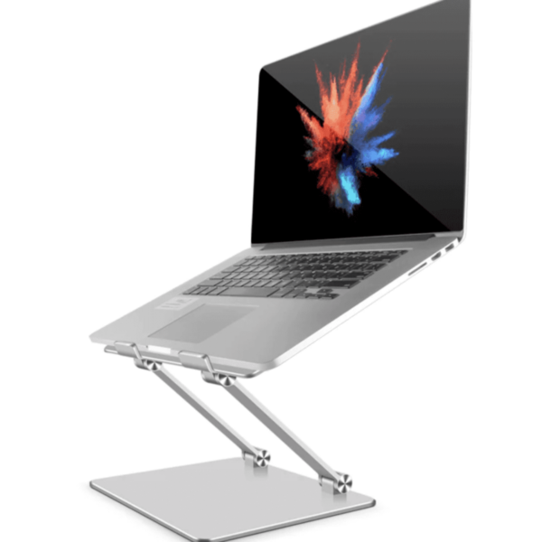 A laptop on a silver adjustable stand with a colorful splash design on the screen.