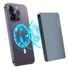 Smartphone and external battery pack connected by a glowing magnetic charging field.