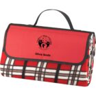 Red plaid blanket with black handle, folded with a healthcare logo and the name Olivia Smith.