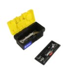 Open toolbox with yellow lid, various tools inside and outside on a tray.