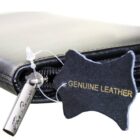 Leather wallet with a Genuine Leather tag and a metal charm attached.