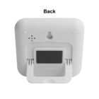 Back view of a white digital clock with a foldable stand.