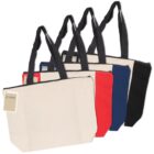 Five tote bags in cream, red, blue, and black with black handles, displayed side by side.