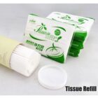 Packaged tissue refills and cotton pads on display with labels in green and white.