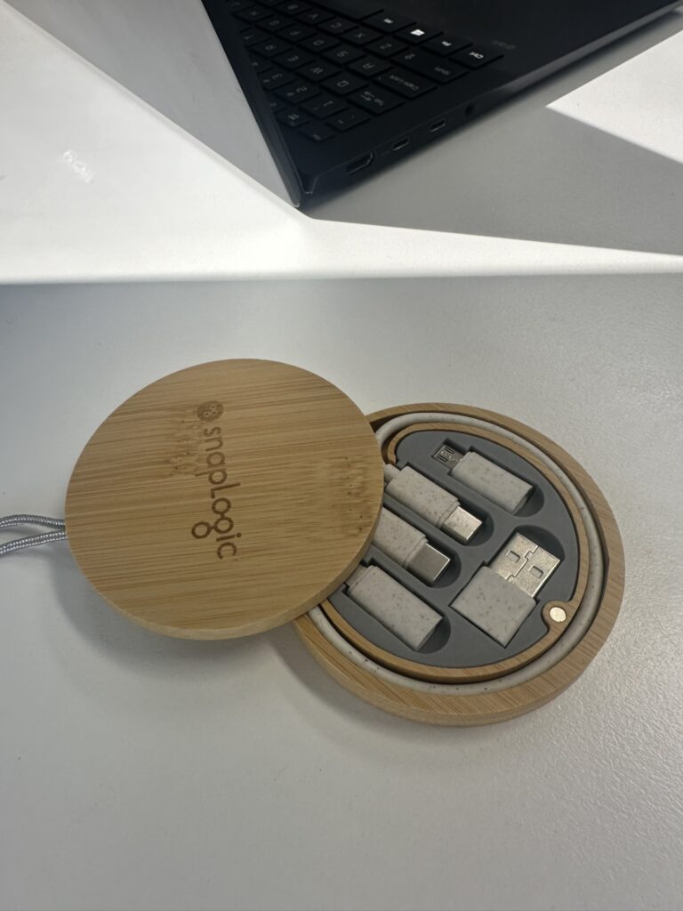 Circular wooden USB adapter set near a laptop, perfect for company needs or smartphone charging.
