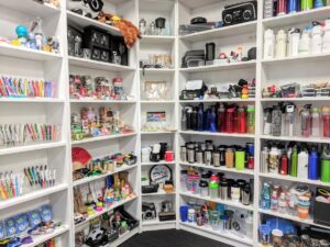 A cabinet full of different promotional products