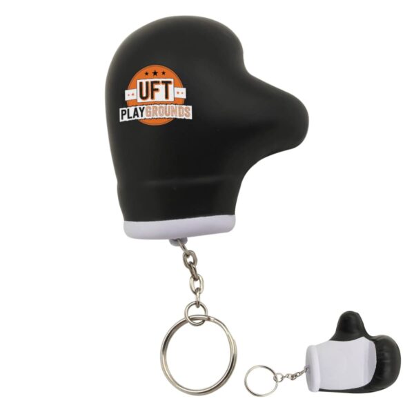 Boxing glove-shaped keychain with UFT Playgrounds logo, featuring a metallic key ring.