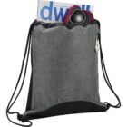 Gray drawstring bag with magazine, sunglasses, and cloth protruding from the top.