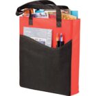 Red and black tote bag with magazines, pens, and papers inside.