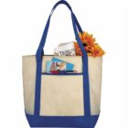 Beige tote bag with blue straps, filled with newspapers and sunflowers.