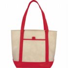 Canvas tote bag with red handles and trim, beige body, and a front pocket.