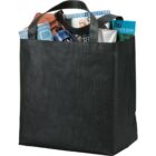 Black tote bag filled with magazines, a towel, and toiletries.