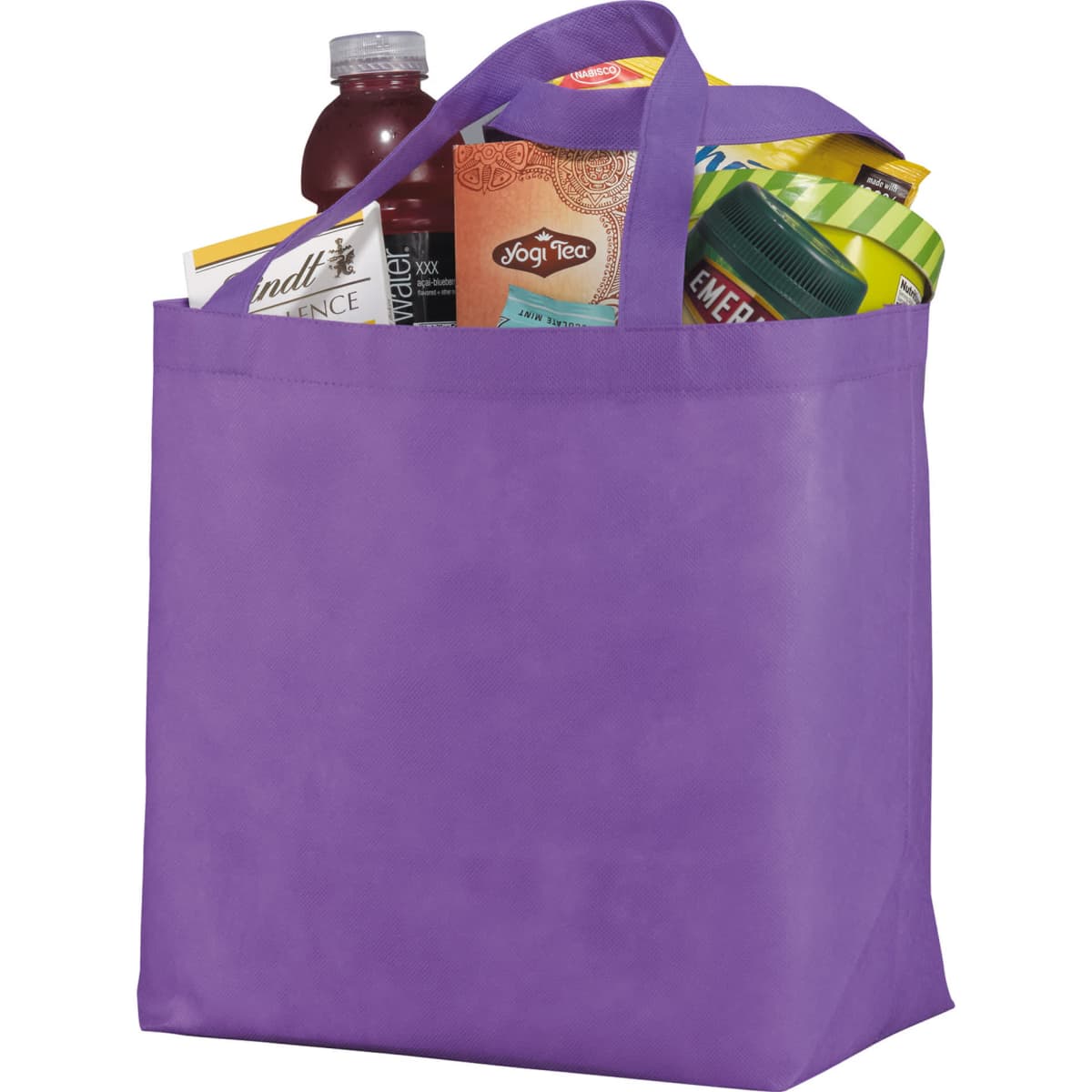 Purple tote bag filled with groceries, including a drink, tea, and snacks.