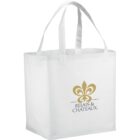 White tote bag with a gold logo and text reading Relais & Chateaux.