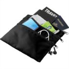 Black travel pouch with passport, travel guide, phone, earphones, pen, and mint pack.
