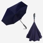 Two dark blue umbrellas, one open and one closed, with ergonomic handles.