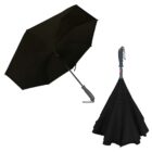 Black umbrella open and folded with a curved handle and inverted closing design.