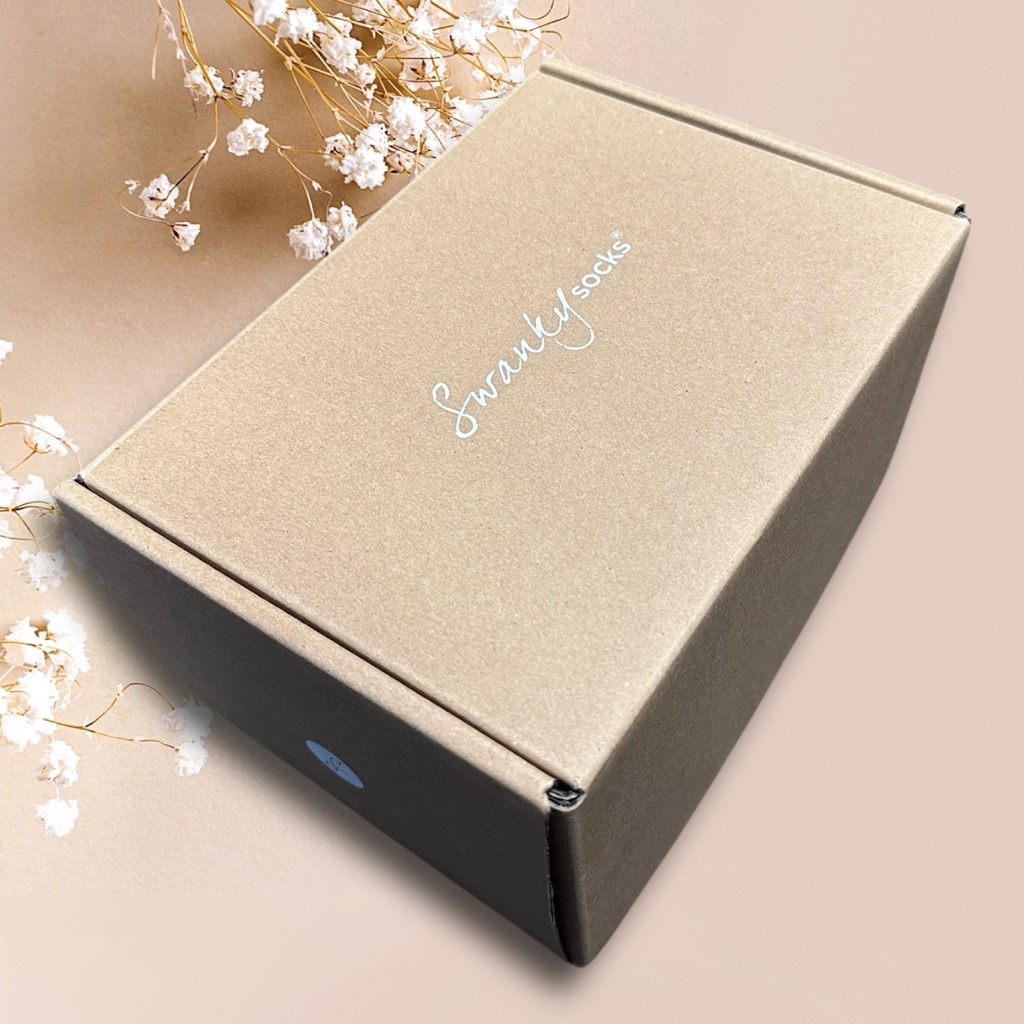 Swanky Socks gift box adorned with dried flowers.