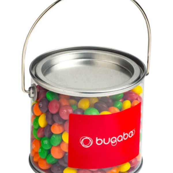 Clear pail filled with colorful candy, with a metal handle and a red bugaboo label on it.